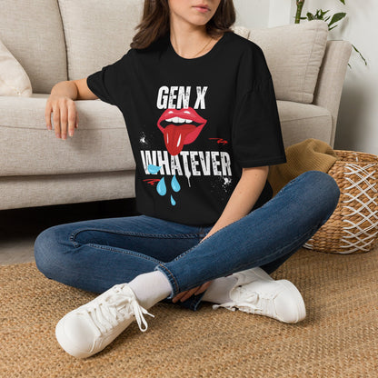A woman sat on a rug next to a couch wearing a black short-sleeve graphic t-shirt featuring the text 'GEN X WHATEVER' in white, with a graphic of red lips. 