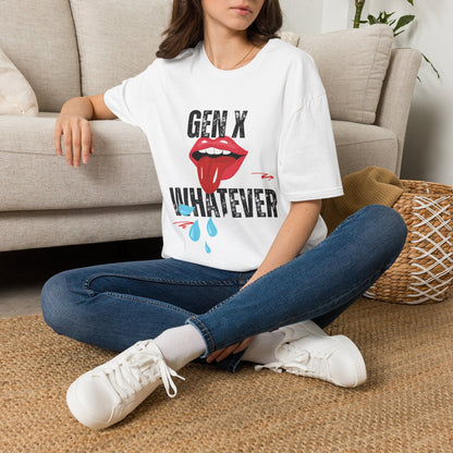 A woman sat on a rug next to a couch wearing a white short-sleeve graphic t-shirt featuring the text 'GEN X WHATEVER' in black, with a graphic of red lips.