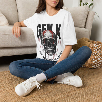 A lady sitting on a rug on the floor next to a beige couch wearing a white t-shirt with a skull and dripping blood with the text " GEN X MOST DANGEROUS GENERATION" with jeans and white sneakers