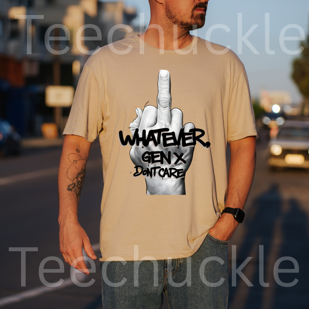 A man standing outdoors wearing a  sand graphic t-shirt featuring a middle finger gesture design, and text "WHATEVER GEN X DON'T CARE" 