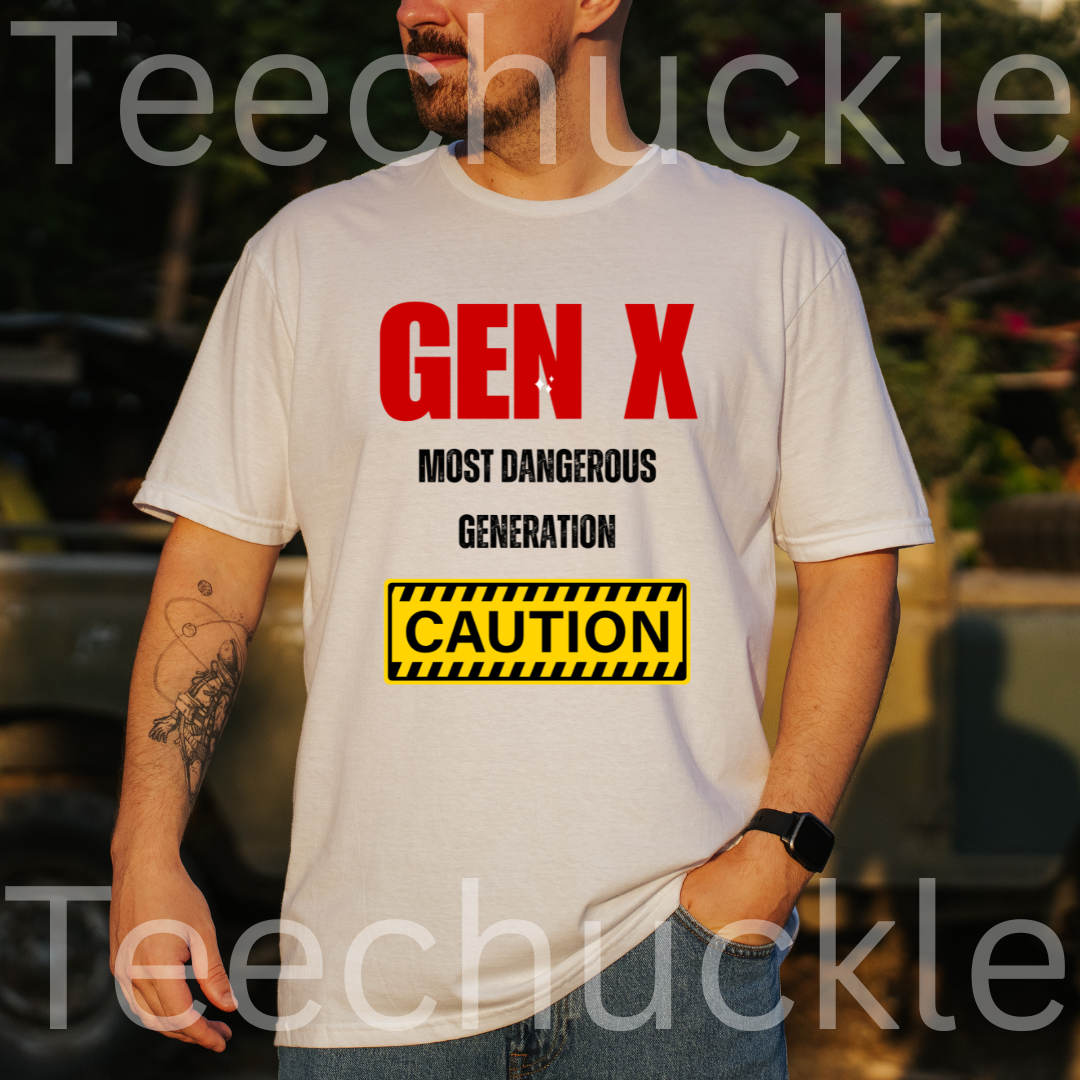 A man wearing a white graphic t-shirt with red and black text reading 'GEN X MOST DANGEROUS GENERATION' and a yellow caution-style box. The background is an outdoor blurred setting