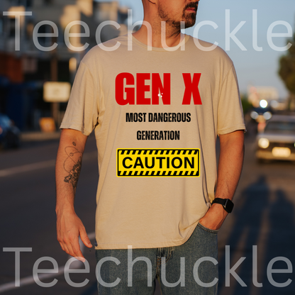 A man wearing a sand graphic t-shirt with a red and black 'GEN X MOST DANGEROUS GENERATION' print and a yellow caution box graphic. The background is a blurred street scene at sunset