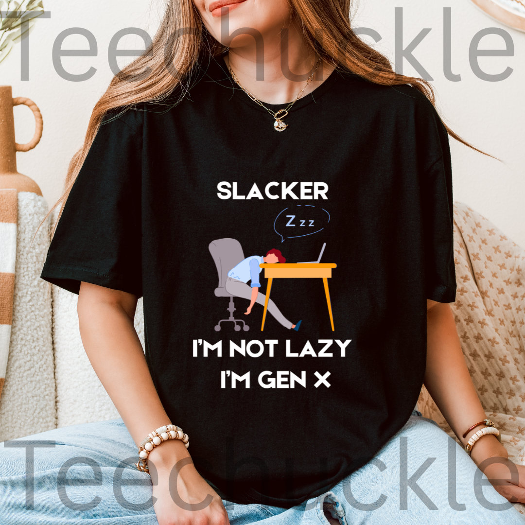 A woman wearing a black graphic t-shirt with the text 'SLACKER I'M NOT LAZY I'M GEN X' and an illustration of a person sleeping at a desk.