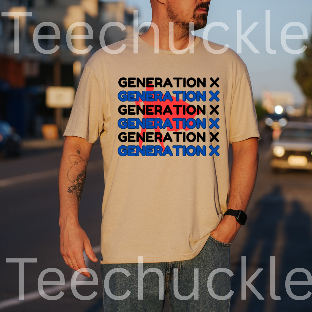 A man wearing a sand graphic t-shirt with the text 'GENERATION X' printed in black and blue, standing outdoors on a street at sunset.