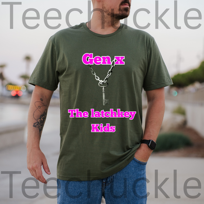 A man wearing a green graphic t-shirt with a silver key and chain design and pink text reading 'Gen x The latchkey Kids', with a blurry outdoor setting in the background.