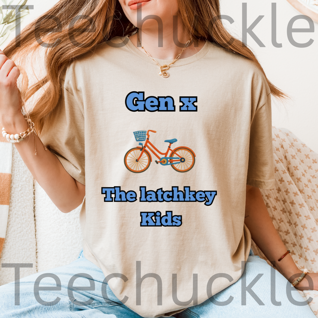 A woman wearing a sand graphic t-shirt with the text 'Gen x The latchkey Kids' and an illustration of an orange bicycle. 