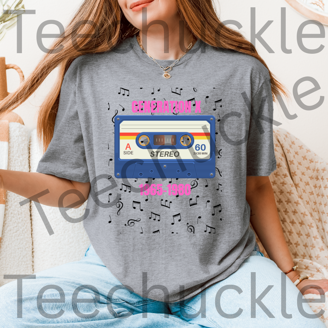 Lady wearing a gray t-shirt with a 80s style cassette tape design with pink text "GENERATION X 1965-1980" and music notes.