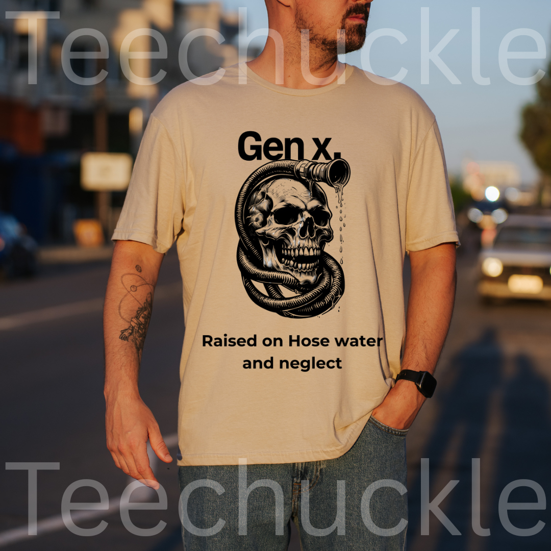 A man wearing a sand graphic t-shirt with a black skull and hose illustration and the text 'Gen X. Raised on Hose water and neglect'.