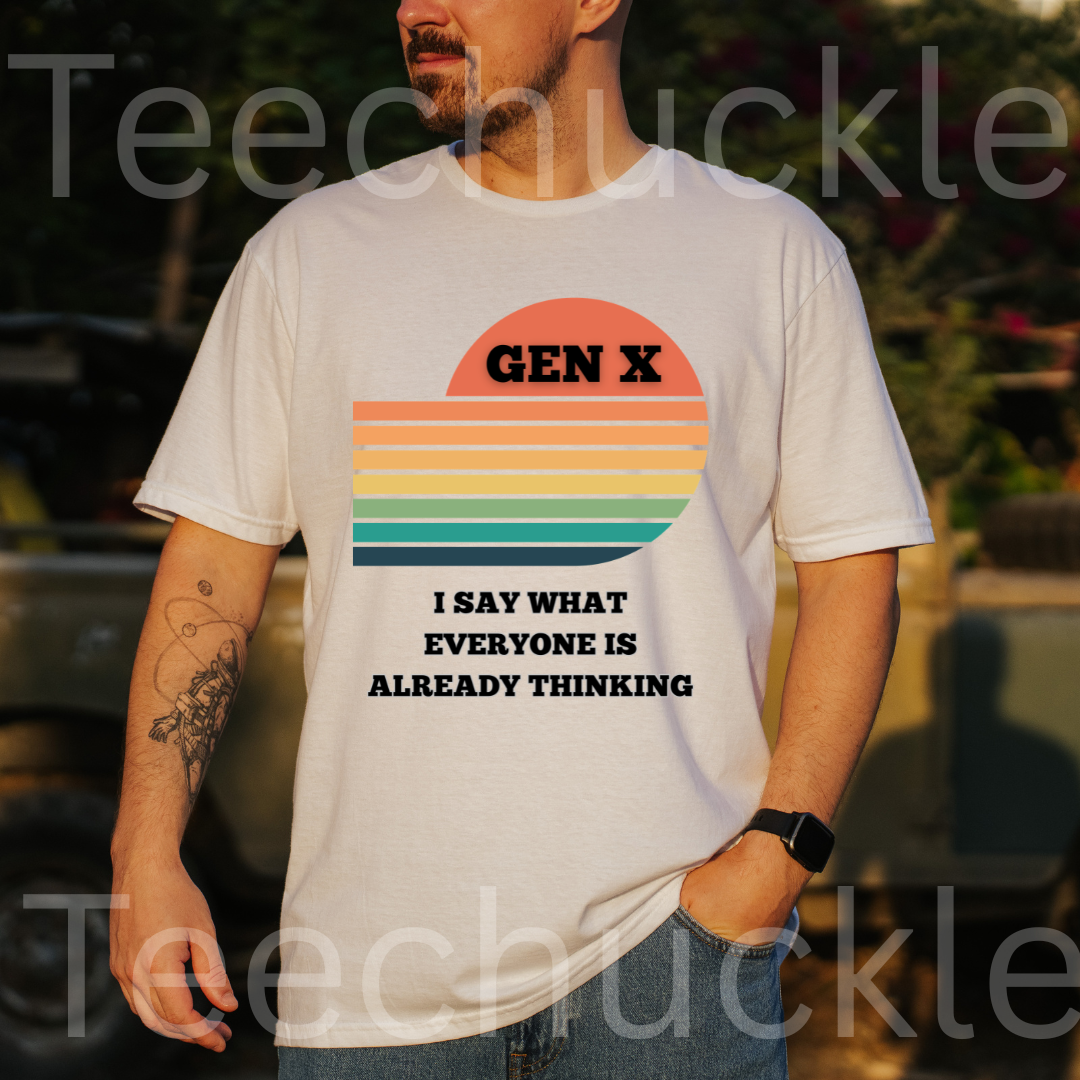A man wearing a white graphic t-shirt with a retro sunset design and the text 'GEN X I SAY WHAT EVERYONE IS ALREADY THINKING'. 
