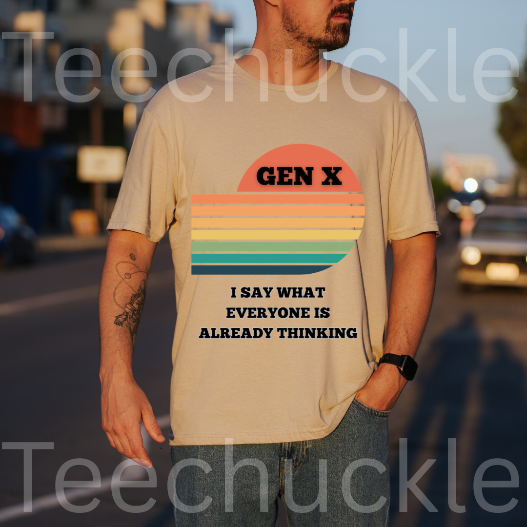 A man wearing a sand graphic t-shirt with a retro sunset design and the text 'GEN X I SAY WHAT EVERYONE IS ALREADY THINKING'. The image has a warm sunset background.
