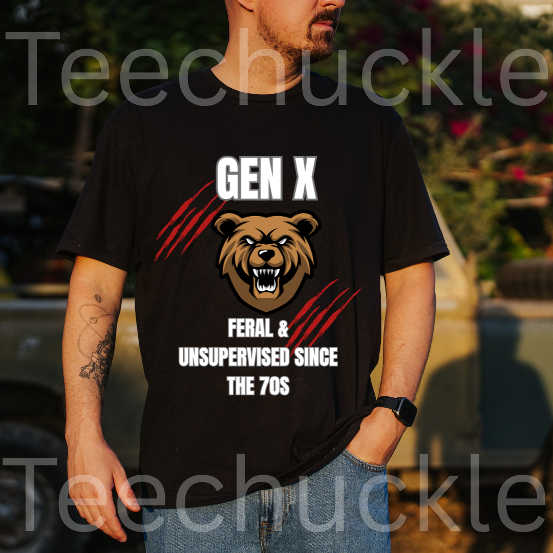 A man wearing a black graphic t-shirt with a bear design and the text 'GEN X FERAL & UNSUPERVISED SINCE THE 70S'. The background is an outdoor blurred setting with a vehicle and foliage.