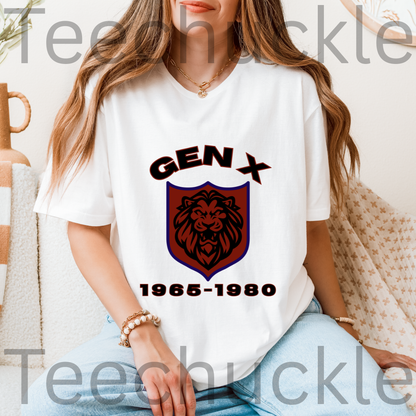 A woman wearing a white graphic T-shirt with a 'GEN X 1965-1980' lion crest design, paired with light blue jeans in a cozy indoor setting.