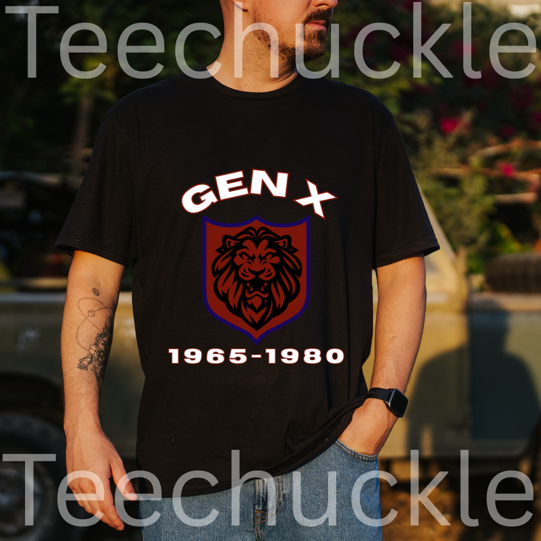 A man wearing a black graphic t-shirt with a 'GEN X 1965-1980' lion crest design, set against a blurred outdoor background.