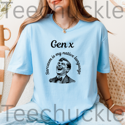 A woman wearing a light blue graphic t-shirt with a black print that reads 'Gen x' and 'Sarcastic is my native language' around a laughing man's portrait.