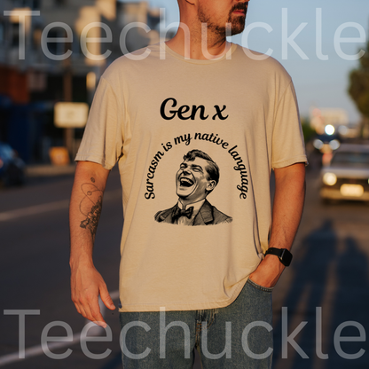 A man wearing a sand graphic t-shirt with a black print that reads 'Gen x' and 'Sarcasm is my native language' around a laughing man illustration. The background is a blurred street at sunset