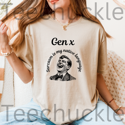 A woman wearing a sand graphic t-shirt with a black print that reads 'Gen x' and 'Sarcasm is my native language' around a laughing man's portrait. 