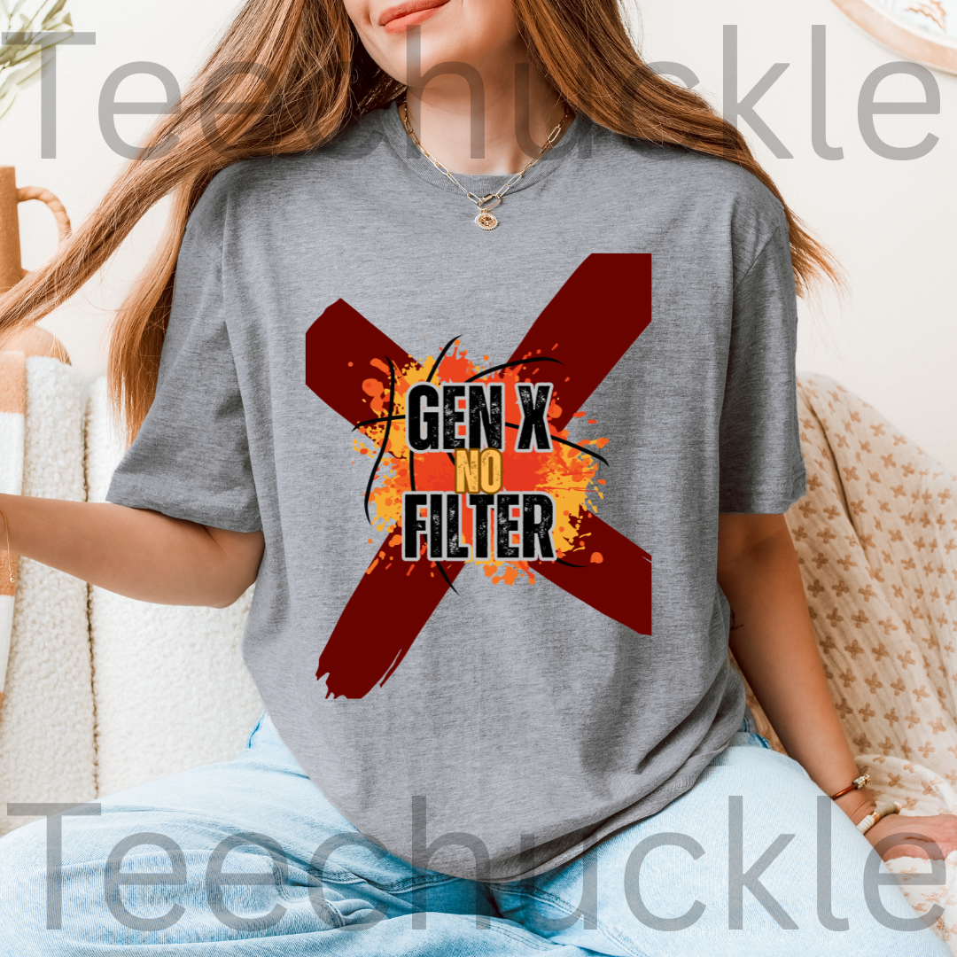 A woman wearing a gray t-shirt with a graphic print that reads 'GEN X NO FILTER' inside a red 'X' with orange paint splatters. The photo is taken in a cozy indoor setting with a beige textured chair in the background.