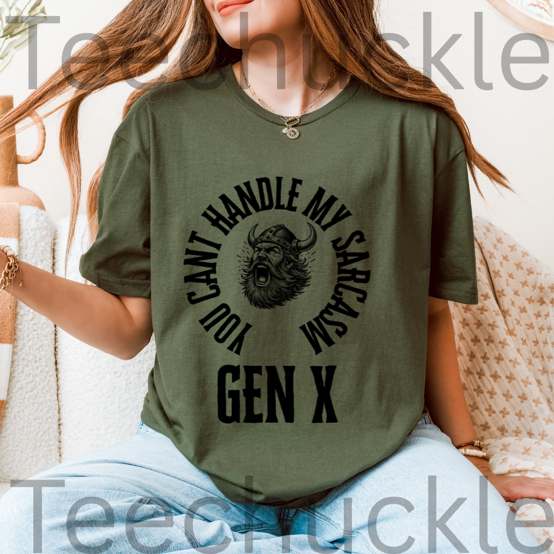 A woman wearing a green graphic t-shirt with a black viking graphic and the text 'YOU CAN'T HANDLE MY SARCASM GEN X'.