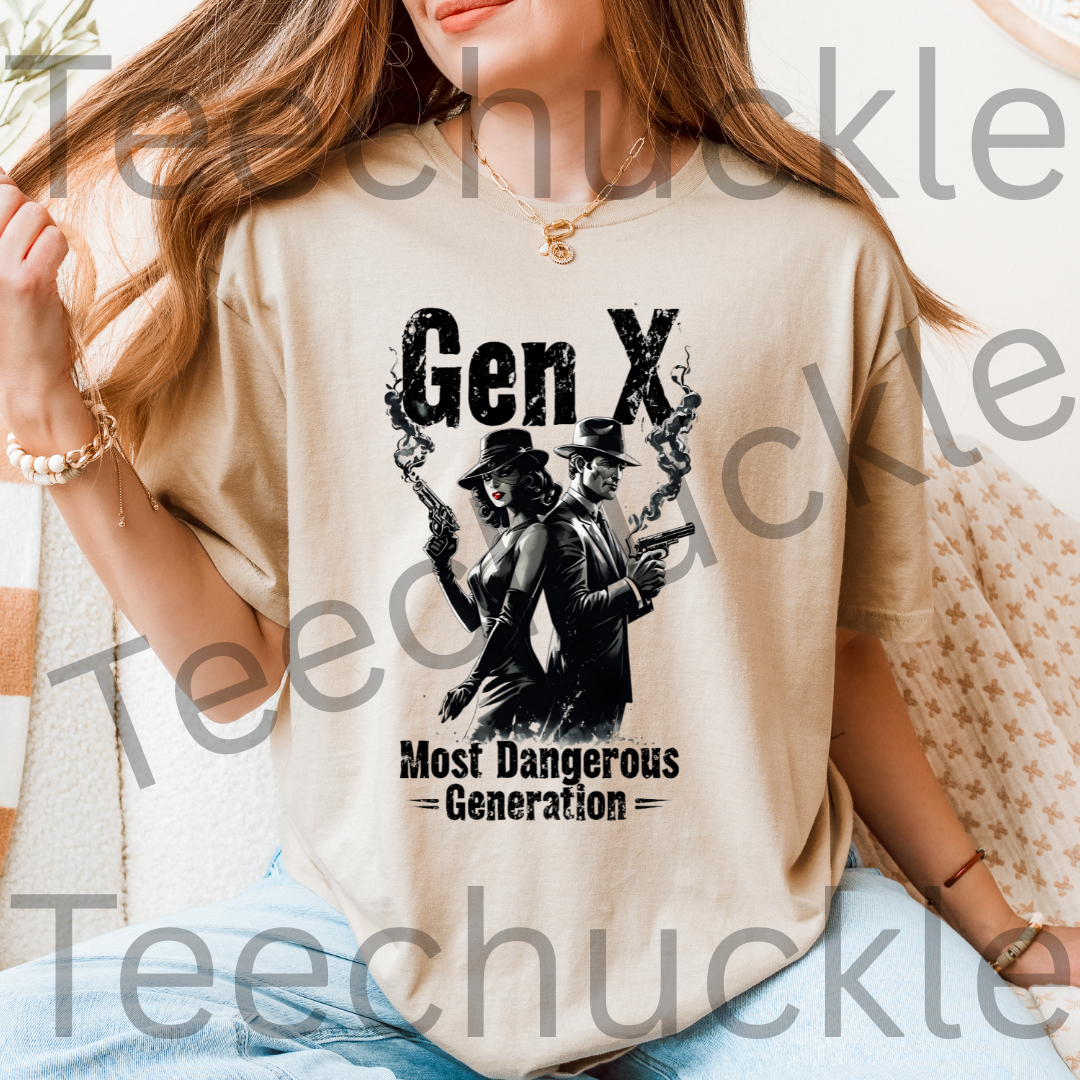A woman wearing a sand graphic t-shirt with a black print that reads 'Gen X Most Dangerous Generation' featuring an illustration of two figures with smoking guns in an indoor setting.