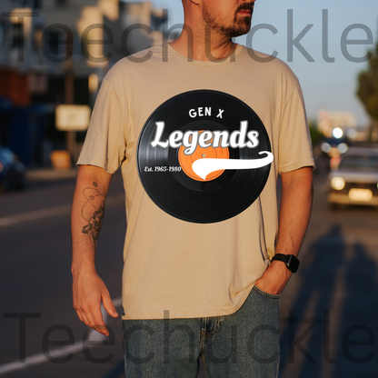 A man wearing a sand graphic t-shirt with a black vinyl record design that reads 'GEN X Legends Est. 1965-1980' 