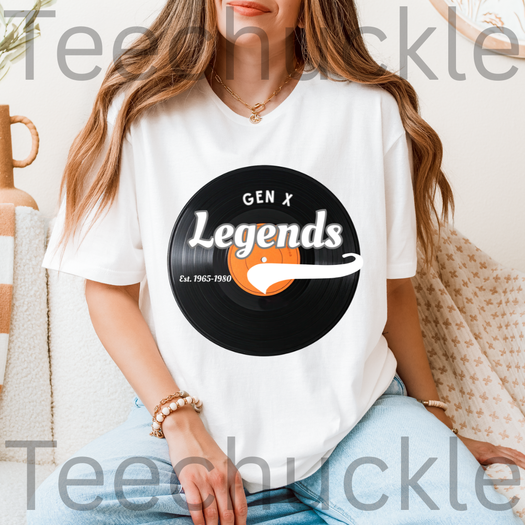 A woman sitting on the couch wearing a white t-shirt with a vinyl record with the text "GEN X LEGENDS EST 1965-1980"