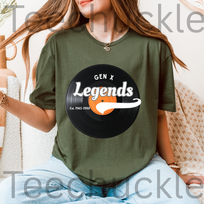 A woman wearing a green graphic t-shirt with a black vinyl record design that reads 'GEN X Legends Est. 1965-1990' 