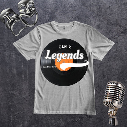 A gray crewneck t-shirt featuring a retro graphic of a black vinyl record with the text 'GEN X Legends Est. 1965-1980' styled on a dark textured background with vintage silver microphones.