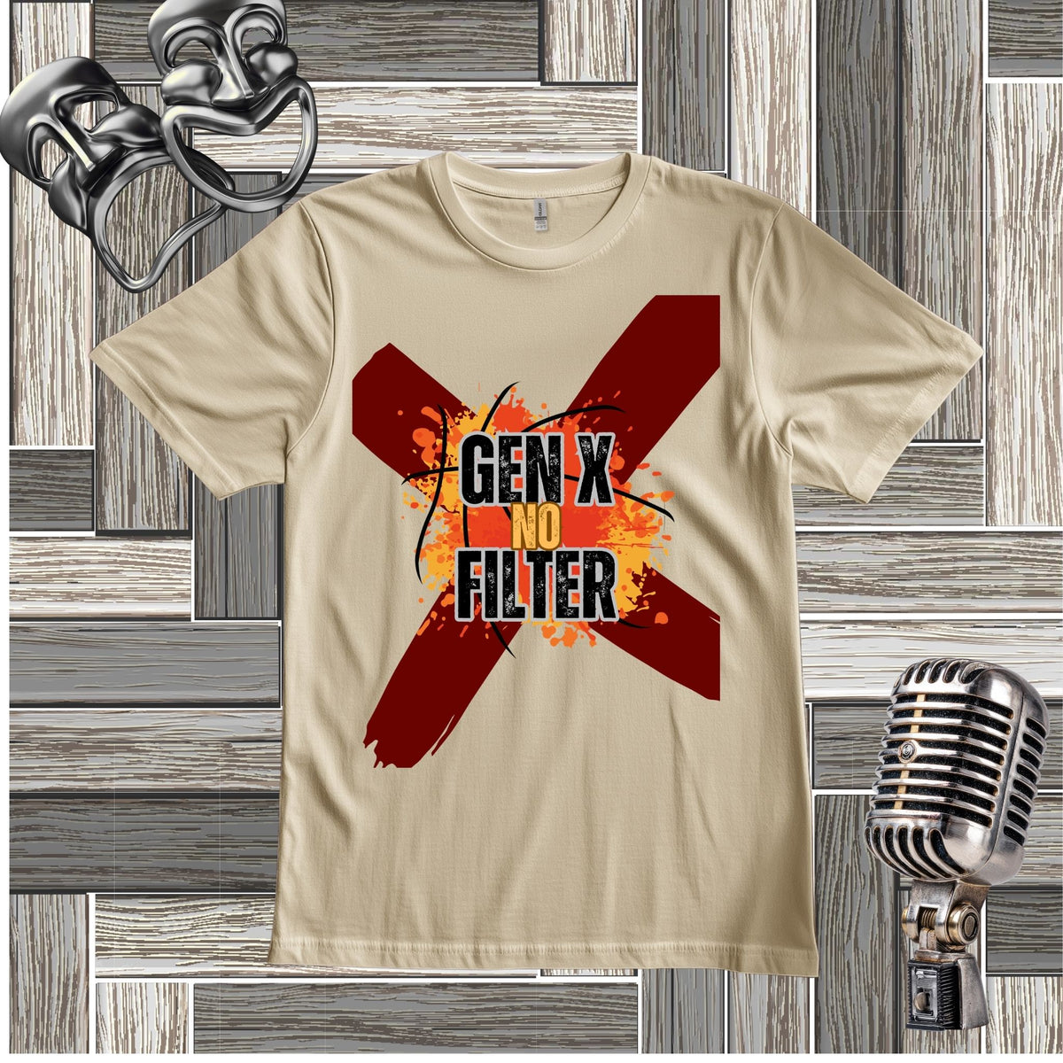 A sand short-sleeve t-shirt with a graphic print featuring a red 'X' and the text 'GEN X NO FILTER' in black and orange, displayed on a gray wood plank background with vintage microphone and headphones props.
