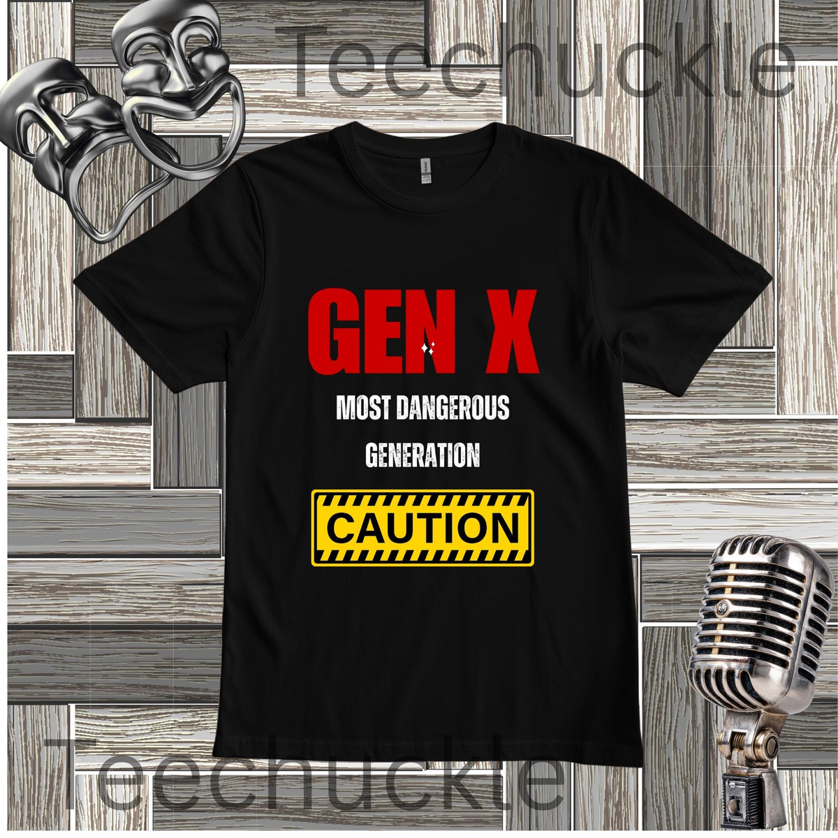 A black short-sleeve graphic T-shirt laid flat on a wood plank background, with large red and white text reading 'GEN X MOST DANGEROUS GENERATION' and a yellow caution-style box below. Decorative vintage-style props including a silver mask, microphone, and metallic object appear around the shirt