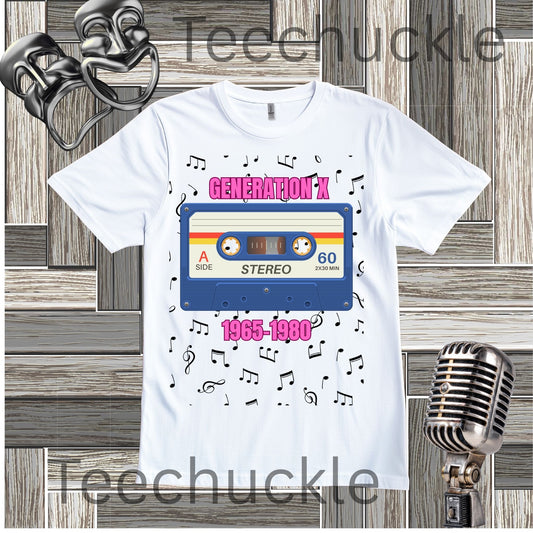 A white graphic t-shirt featuring a retro 1980s cassette tape design with the text 'GENERATION X' and '1965-1980' surrounded by musical notes. The t-shirt is displayed on a rustic wood plank background with vintage microphone and theatrical mask props.
