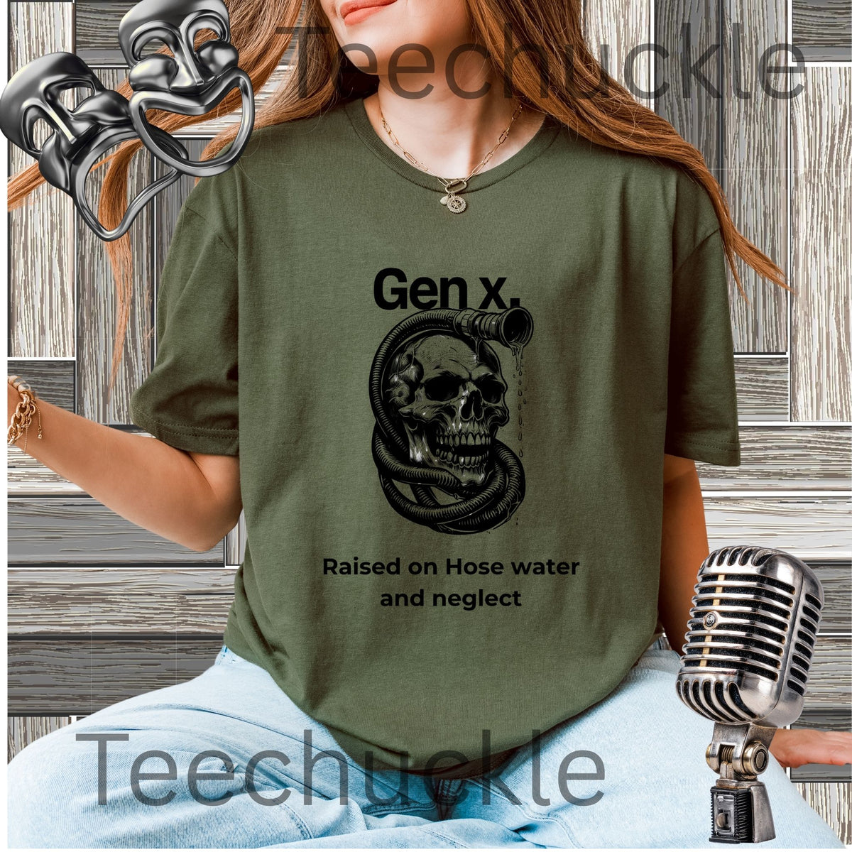 A woman wearing a green graphic t-shirt with a black skull and snake design and the text 'Gen x. Raised on Hose water and neglect'.