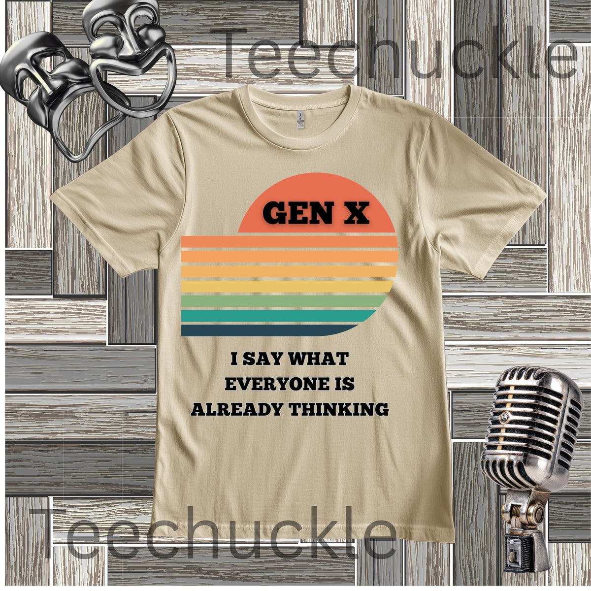 A sand graphic t-shirt featuring a retro sunset design with the text 'GEN X' and 'I SAY WHAT EVERYONE IS ALREADY THINKING' in black. The t-shirt is displayed on a gray wood panel background with vintage microphone and headphones props