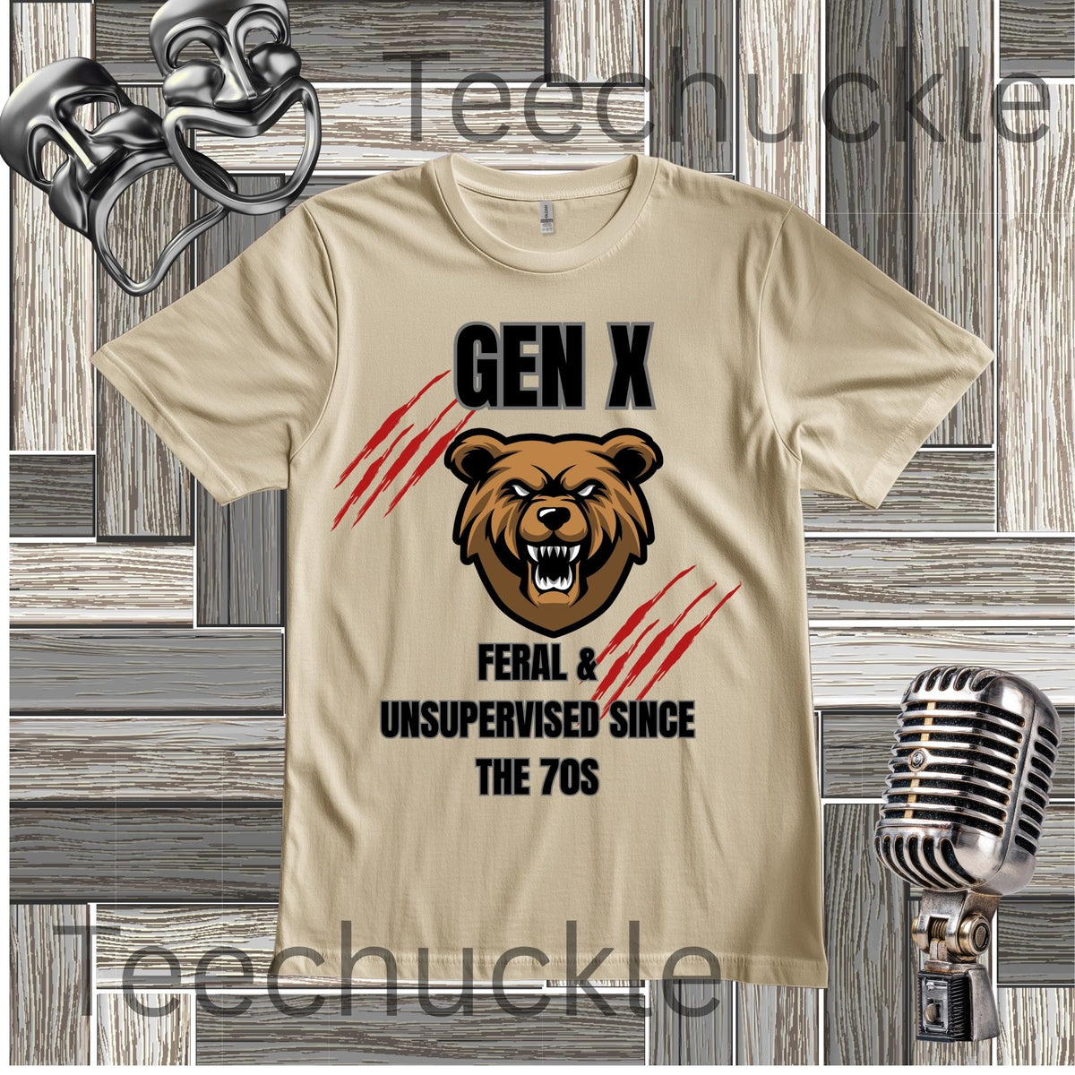 A sand graphic t-shirt featuring a roaring bear head, red claw marks, and the text 'GEN X FERAL & UNSUPERVISED SINCE THE 70S' on a rustic wood plank background. A metal microphone and headphones are shown as props