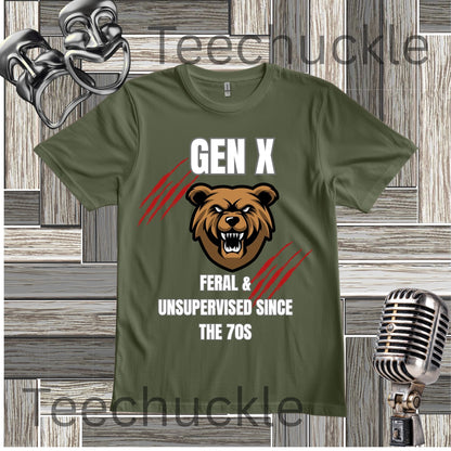A green graphic t-shirt featuring a brown bear head illustration and the text 'GEN X FERAL & UNSUPERVISED SINCE THE 70S' with red claw marks. The t-shirt is displayed on a gray wood panel background with vintage-style microphones and a gold mask prop