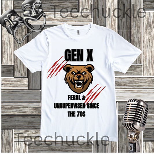 A white short-sleeve graphic T-shirt laid flat on a wood plank background, featuring a brown bear head illustration, black text reading 'GEN X FERAL & UNSUPERVISED SINCE THE 70s', and red claw-stripe graphics. There are decorative vintage microphones in the corners.