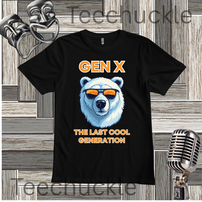 A white short-sleeve graphic T-shirt laid flat on a wood plank background, with black text reading 'Gen x' and 'The last cool generation' a  polar bear illustration. Decorative vintage theater masks and a retro microphone appear around the shirt.