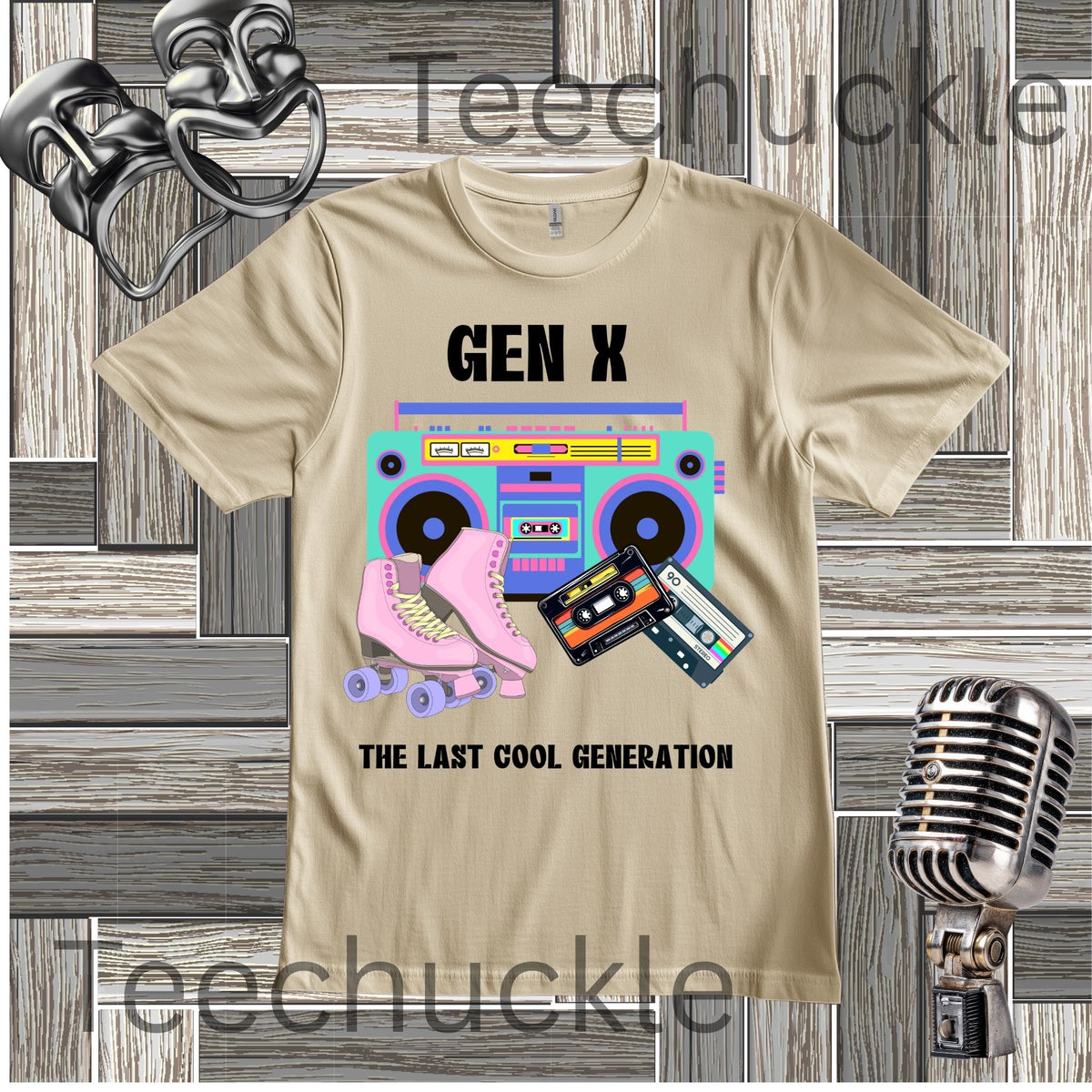 A sand graphic t-shirt featuring a retro 80s boombox, pink roller skates, and cassette tapes with the text 'GEN X THE LAST COOL GENERATION'. The t-shirt is displayed on a gray wood-plank background with vintage microphone 