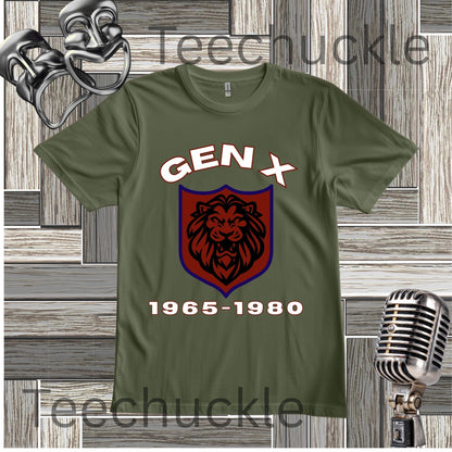 A green graphic t-shirt featuring a 'Gen X' theme with a lion crest and the years '1965-1980'. The t-shirt is displayed on a gray wood-paneled background with vintage props including a silver microphone and a metal mask