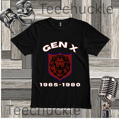 A black short-sleeve graphic T-shirt displayed flat against a rustic wood plank background. The shirt features a large front graphic with the text 'GEN X' in white above a red and purple shield containing a black lion head, and '1965-1980' in white below.