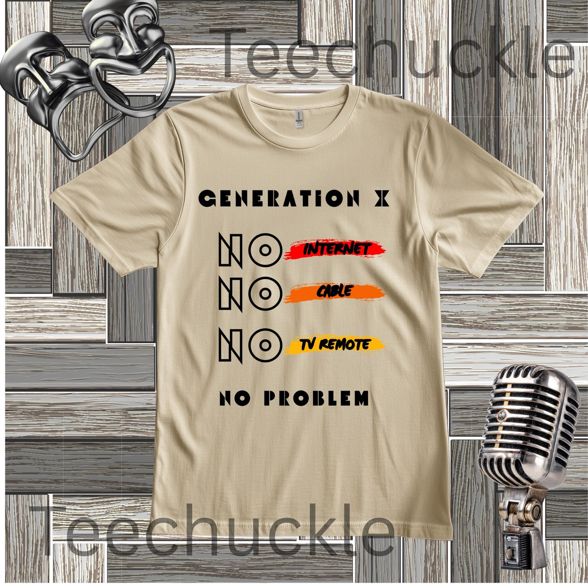 A sand graphic t-shirt displayed on a gray wood plank background with vintage-style microphones. The t-shirt features a black text graphic that reads 'GENERATION X NO INTERNET NO CABLE NO TV REMOTE NO PROBLEM' with 'NO' highlighted by red, orange, and yellow brushstroke accents.
