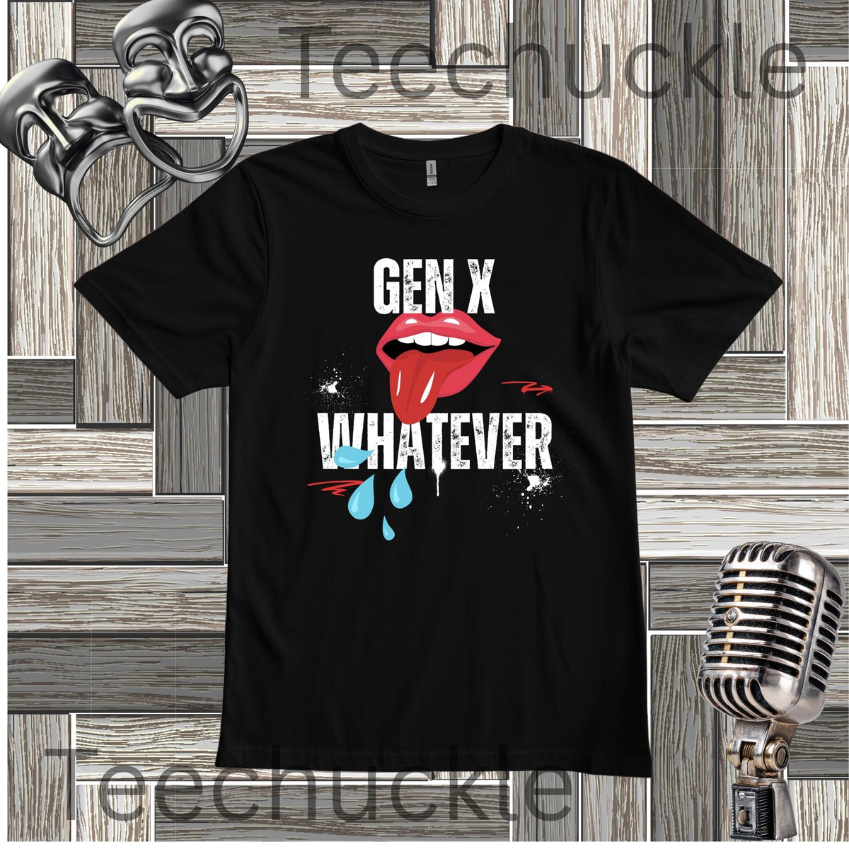 A black short-sleeve graphic t-shirt featuring the text 'GEN X WHATEVER' in white, with a graphic of red lips. The shirt is displayed on a gray wood panel background with vintage-style props including a silver microphone and a metal mask.