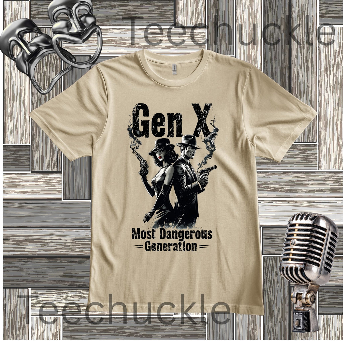 A sand coloured t-shrt with a graphic of a man and woman standing back to back holding a smoking gun with the text "GEN XMOST DANGEROUS GENERATION" on a wooden background with a vintage microphone and comedy masks in the background.