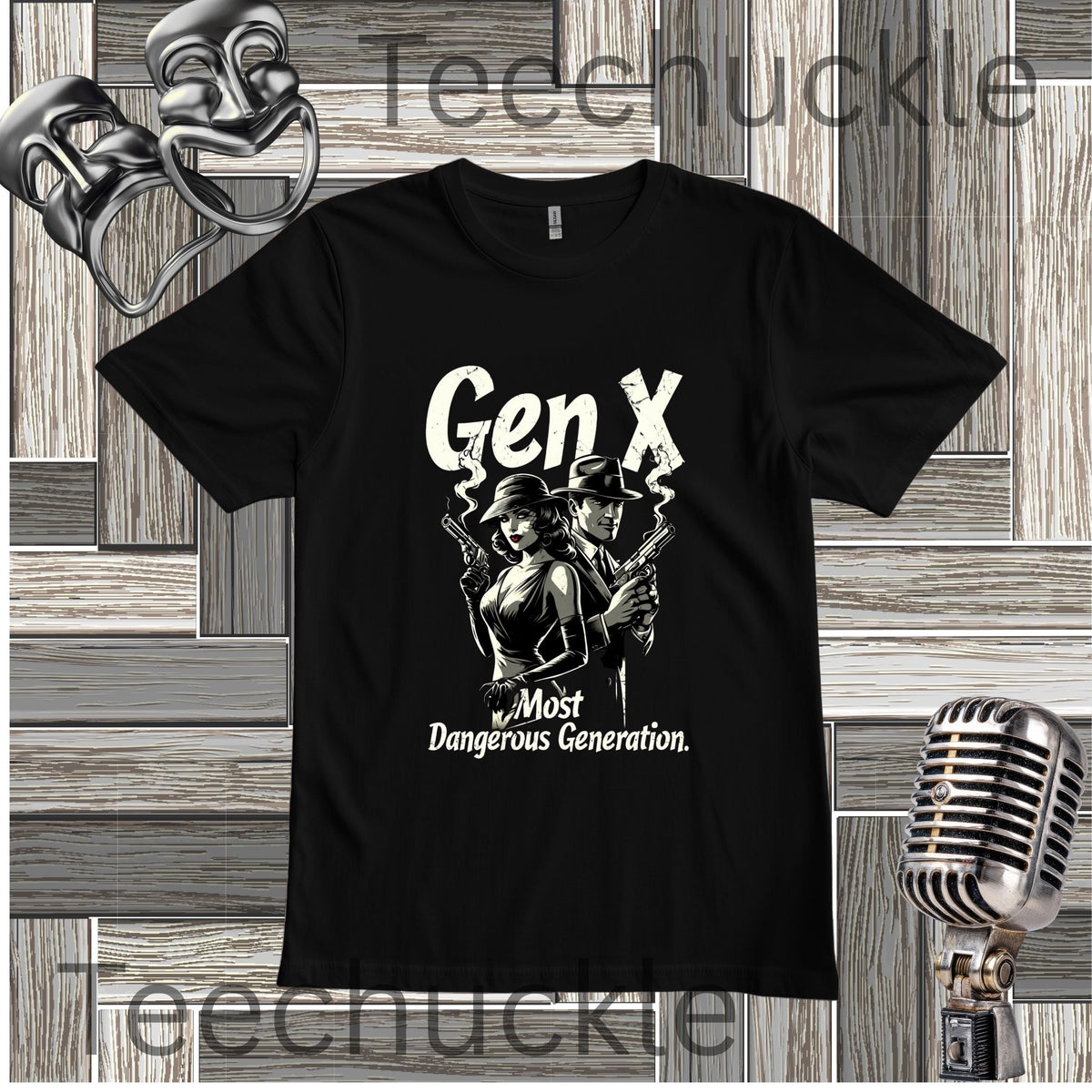 A Black t-shirt with a graphic of a man and woman standing back to back holding smoking guns, with the text "GEN X MOST DANGEROUS GENERATION" laying on a wooden background with retro microphone and comedy masks