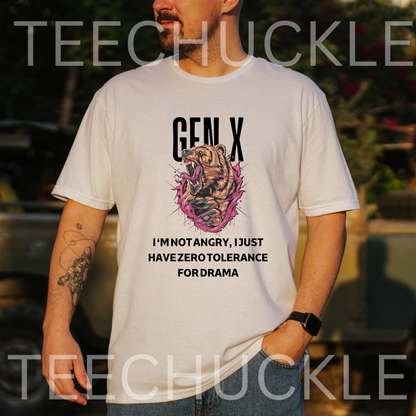 A man wearing a white graphic t-shirt with a bear illustration and the text 'GEN X I'M NOT ANGRY, I JUST HAVE ZERO TOLERANCE FOR DRAMA' and the background is a blurred outdoor setting.