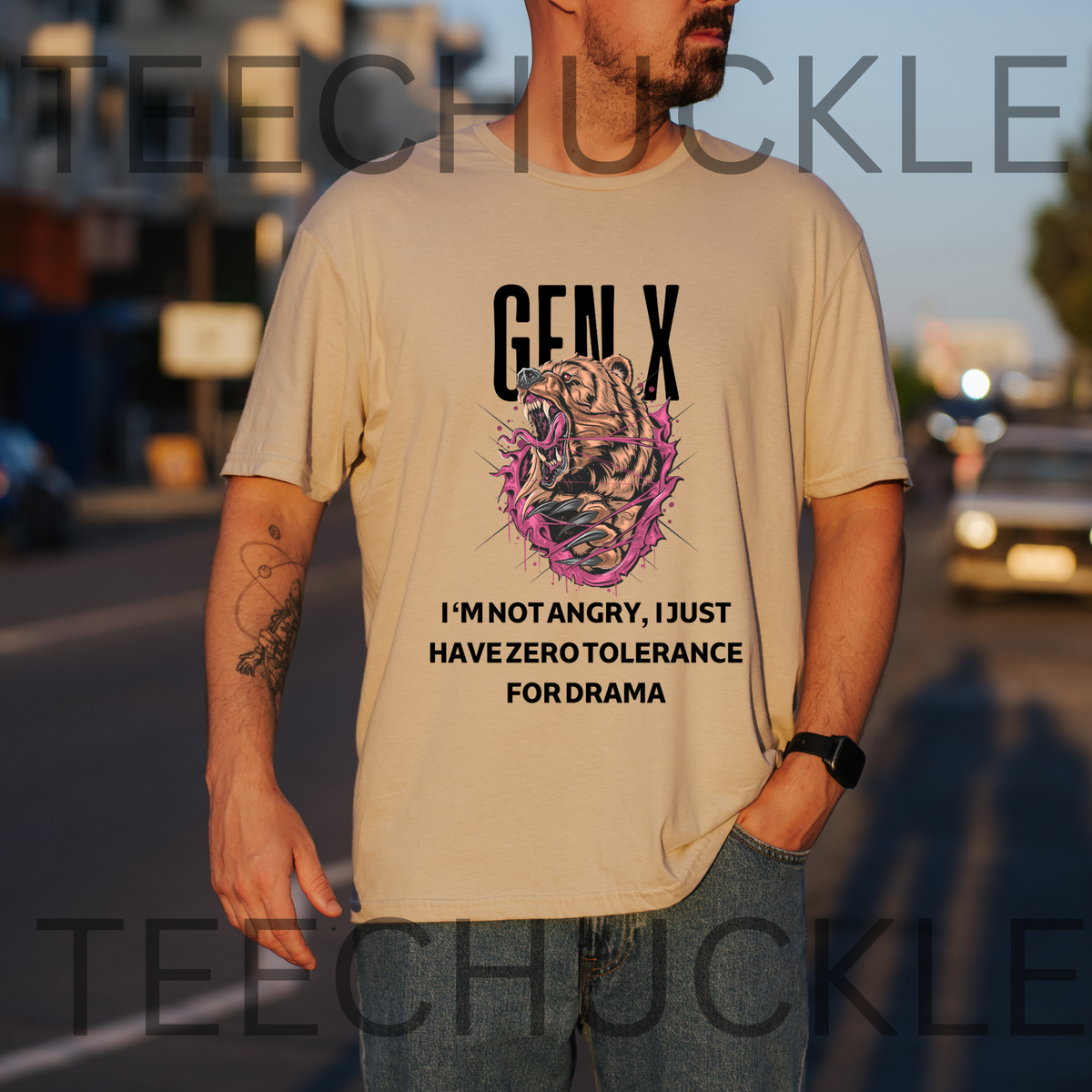 A man wearing a sand graphic t-shirt with a tiger illustration and the text 'GEN X I'M NOT ANGRY, I JUST HAVE ZERO TOLERANCE FOR DRAMA', and is set in an outdoor street environment.