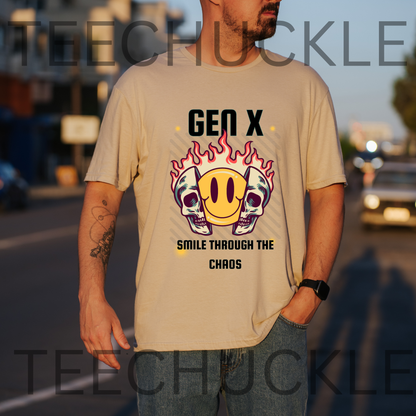 A man wearing a sand graphic t-shirt with a 'Gen X Smile Through The Chaos' design featuring skulls and a smiley face in flames, standing outdoors on a street at sunset.