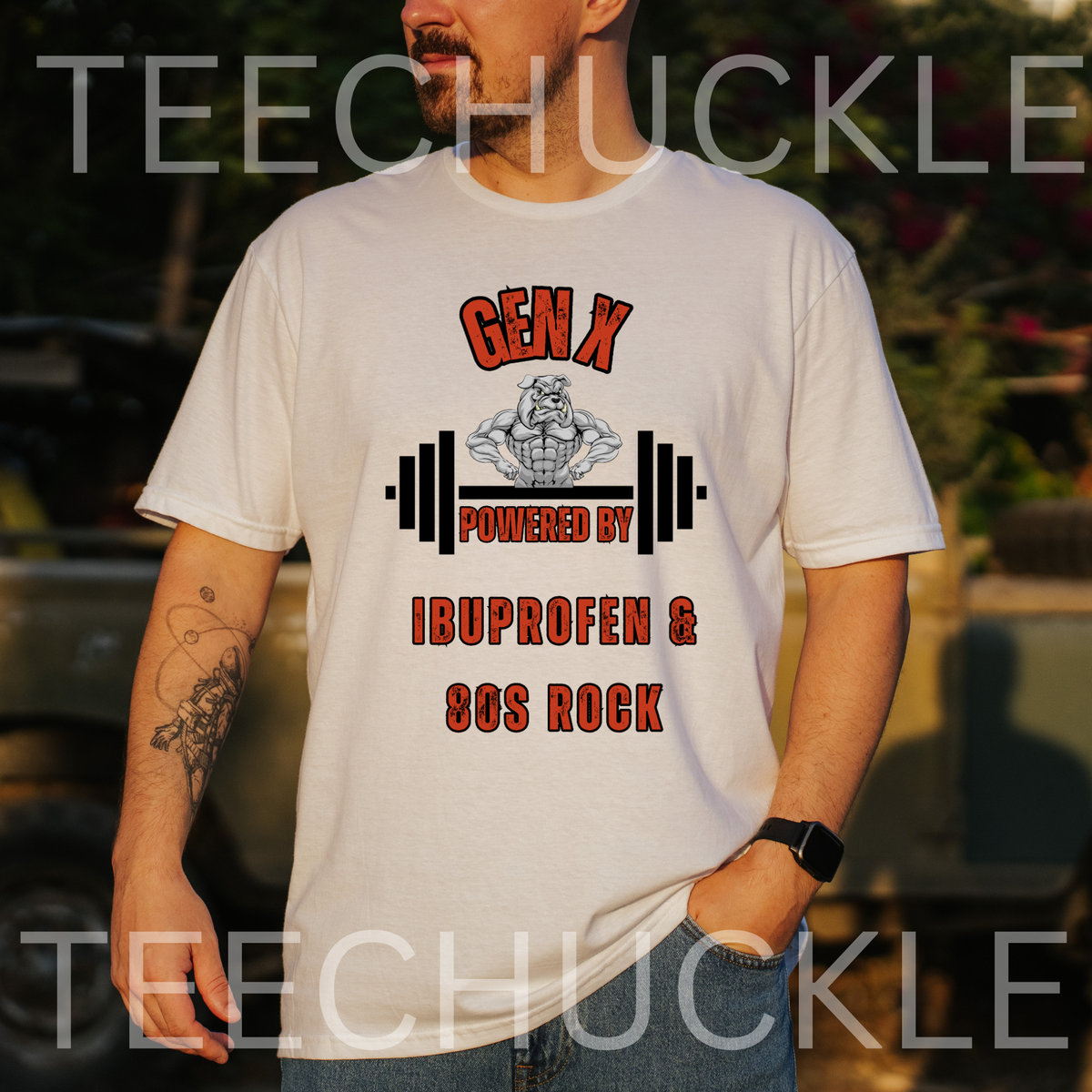 A man wearing a white graphic t-shirt with a 'GEN X POWERED BY IBUPROFEN & 80S ROCK' design featuring a bulldog with barbell  .