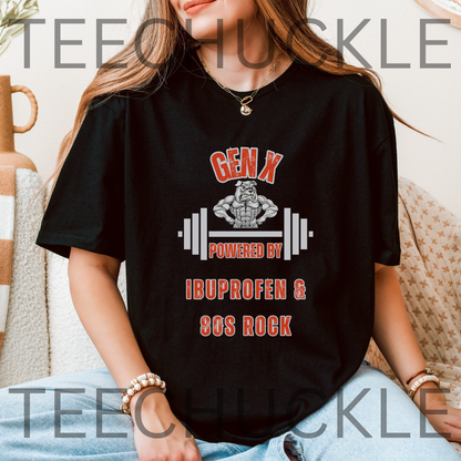 A woman wearing a black graphic t-shirt with a red and white design that reads 'GEN X POWERED BY IBUPROFEN & 80S ROCK' with a barbell and muscular figure. 