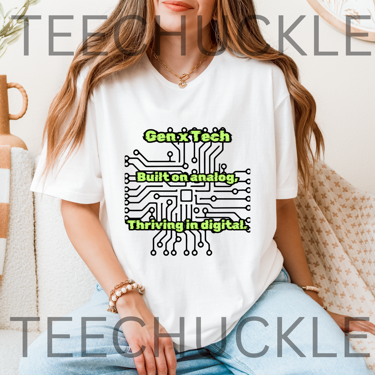 A woman wearing a white graphic T-shirt with a green and black circuit board design and the text 'Gen X Tech Built on analog, thriving in digital.