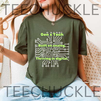 A woman wearing a olive green graphic t-shirt with a white circuit board design and the green text 'Gen X Tech Built on analog, Thriving in digital.